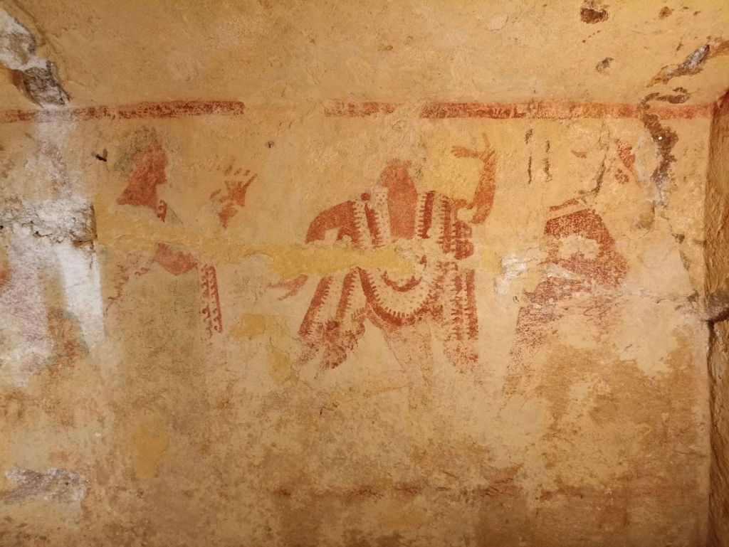 Danza con figuras rojas en la tumbra etrusca de Franco Adamo